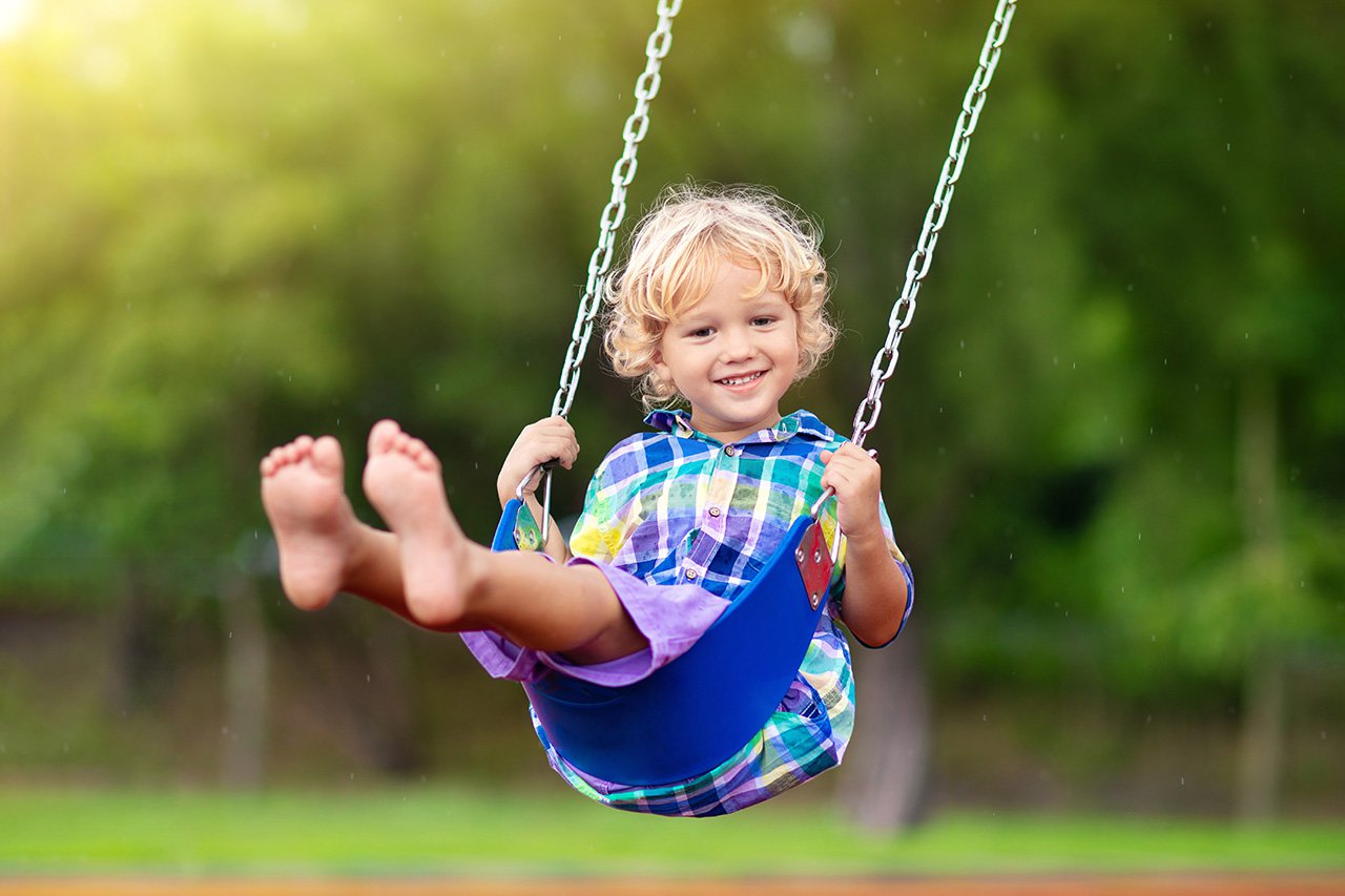 child on playground swing kids play outdoor
